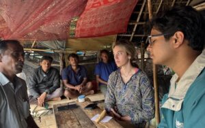 Emma Limor and Sunrit Panda, co-founders of Nirvana Carbon, with farmers in India. Credit: Nirvana Carbon.